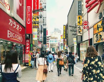 People walking on street in city