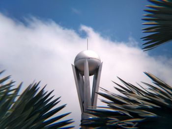 Low angle view of palm tree against sky