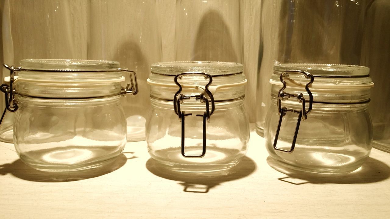 CLOSE-UP OF JAR AND GLASSES