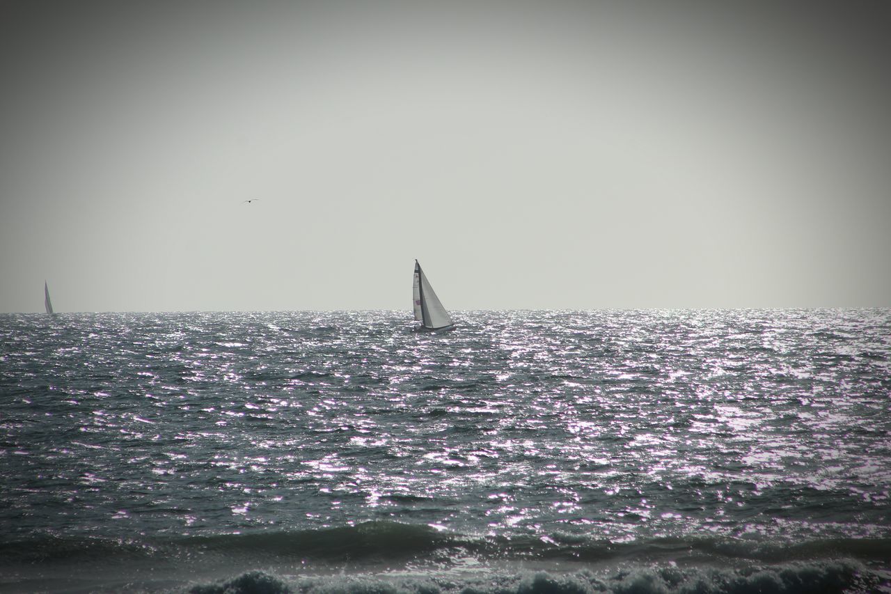 SAILBOAT ON SEA AGAINST CLEAR SKY