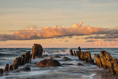 Scenic view of sea against dramatic sky