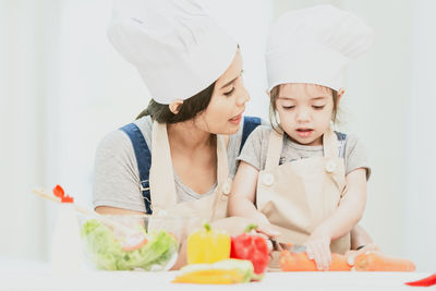 Two people preparing food