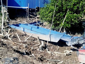 High angle view of abandoned boats moored on field