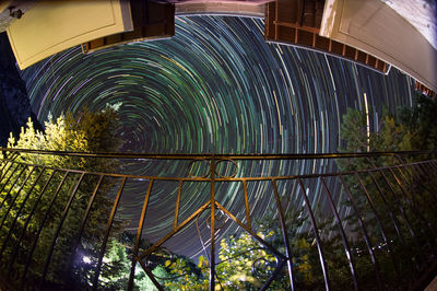 Low angle view of illuminated bridge at night