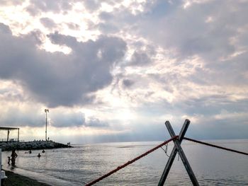 Scenic view of sea against cloudy sky