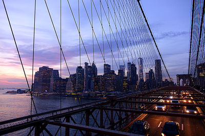 View of suspension bridge with city in background