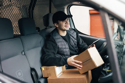 Young man sitting in bus