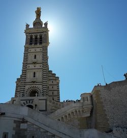 Low angle view of historical building against blue sky