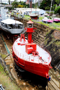 Boats moored at harbor