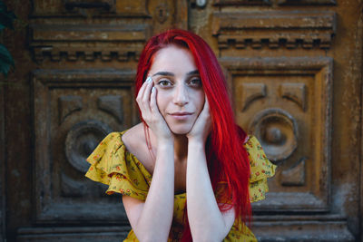 Portrait of woman standing at home