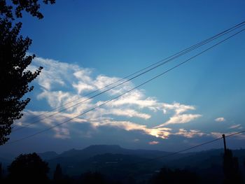 Low angle view of silhouette trees against sky during sunset