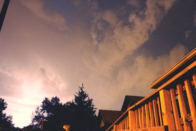 Low angle view of building against cloudy sky