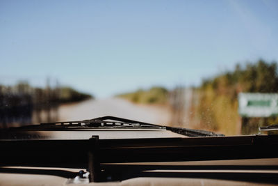 Clear sky seen through windshield of car