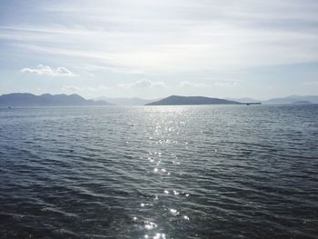Scenic view of sea against cloudy sky