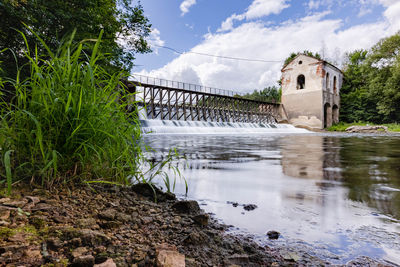 Bridge over river against sky