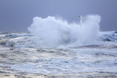 Waves in sea against clear sky