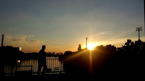 Silhouette of building at sunset