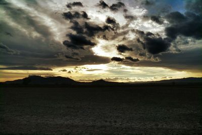 Scenic view of landscape against cloudy sky