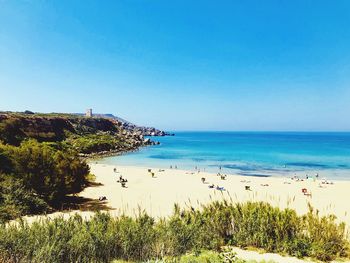 Scenic view of sea against clear blue sky