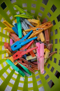 High angle view of multi colored clothespins on floor