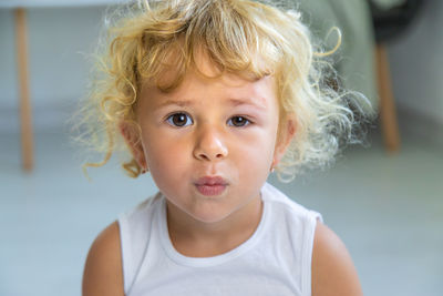 Close-up of cute boy looking away