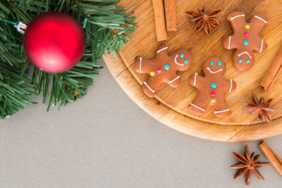 Directly above shot of gingerbread cookies and spices on table