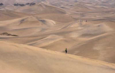 Photographers walking in the death valley desert