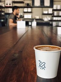 Coffee cup on table in cafe