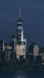 Illuminated buildings against sky at night