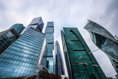 Low angle view of modern buildings against sky in city