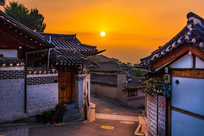 Traditional building against sky during sunset