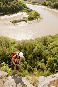 Woman rappelling of cliff in south wales