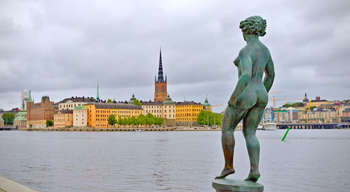 Low angle view of statue against cloudy sky