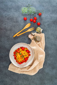 High angle view of meal served in bowl against black background