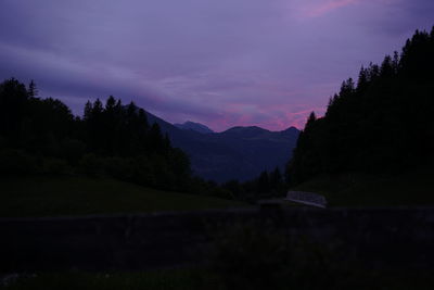 Scenic view of silhouette mountains against sky during sunset