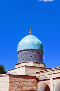 Low angle view of church against clear blue sky