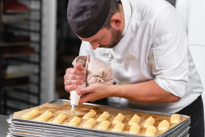 Chef preparing sweet food in commercial kitchen