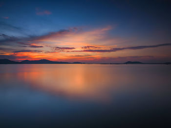 Scenic view of sea against romantic sky at sunset