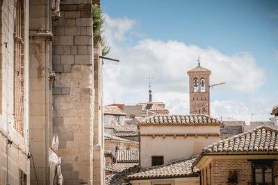 View of buildings in city against sky