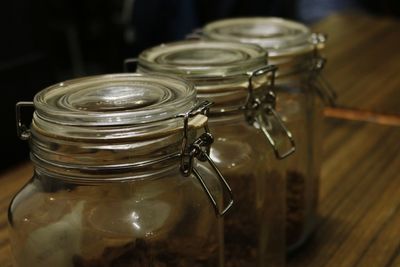 Close-up of glass jars on table