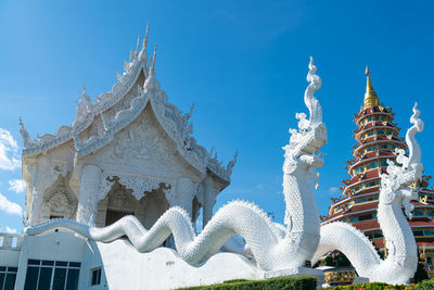 Low angle view of temple against blue sky