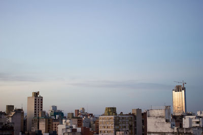 Buildings in city against sky