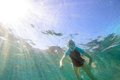 Low angle view of woman snorkeling undersea