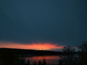 Scenic view of lake at sunset