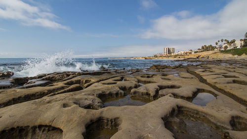 Scenic view of beach against sky