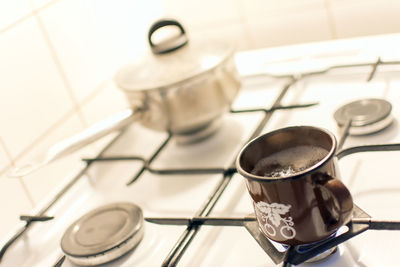 High angle view of coffee cups in kitchen