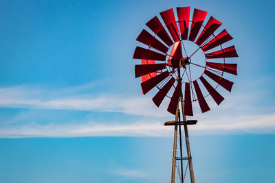 Low angle view of american style windmill against sky