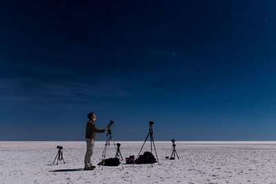 Man taking photos of starry night