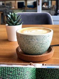 Close-up of coffee cup on table