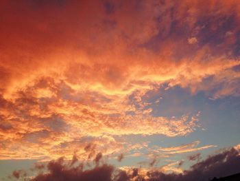 Low angle view of dramatic sky during sunset